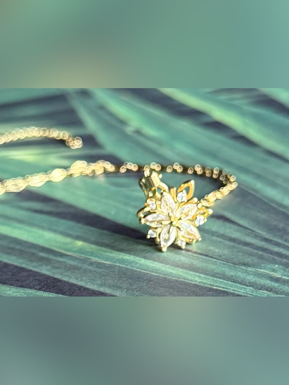 Elegant Gold Floral Pendant Necklace with Clear Stones